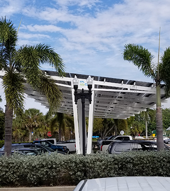 cars parked beneath punta gorda city hall solar canopy