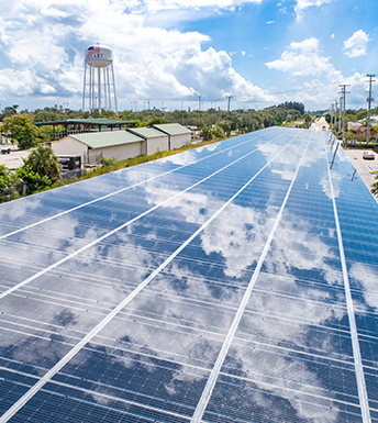 solar canopy reflecting clouds at Kiwanis youth park in Stuart