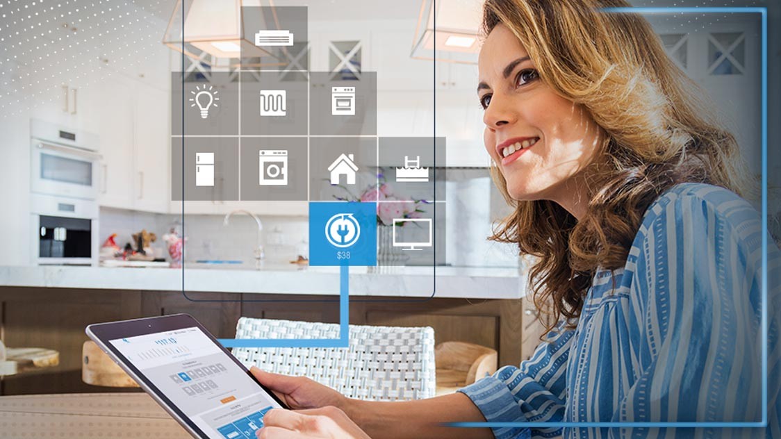 Woman using the energy analyzer on a tablet device