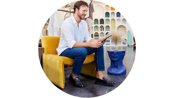 a business owner sitting and using a tablet