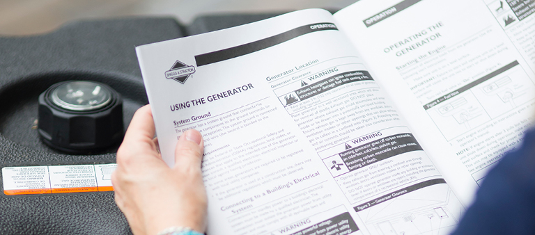 person reading generator safety guide