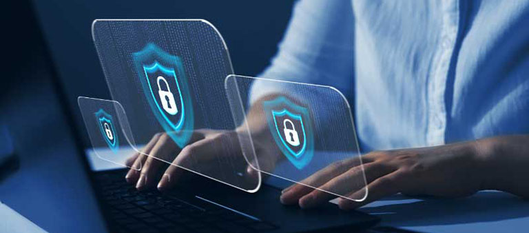hands on a keyboard with digital graphics signifying cyber security